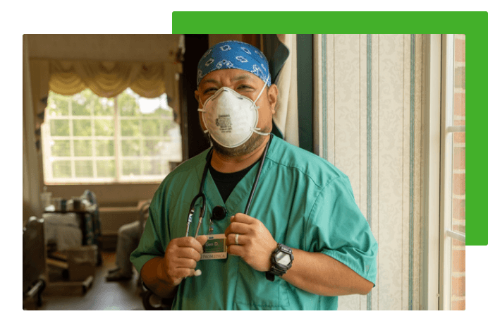 Employee standing by window