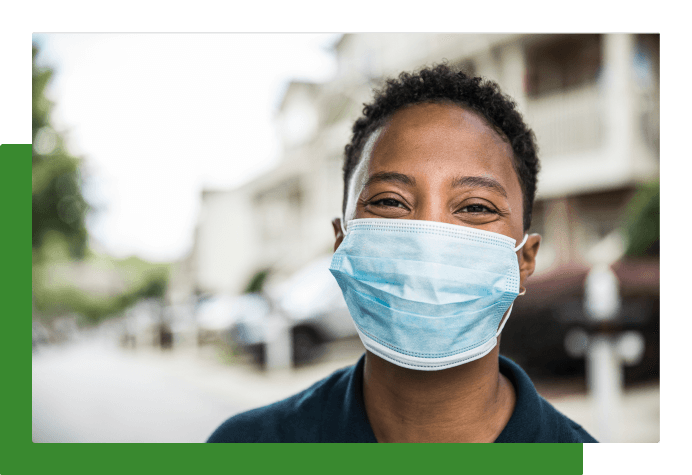 Student smiling with mask on