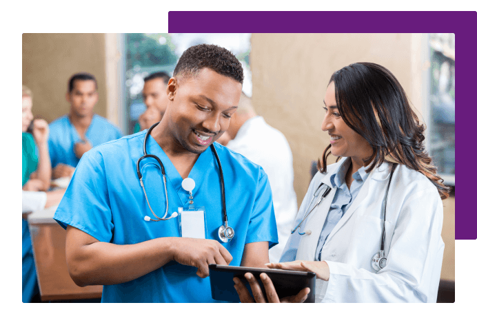 Two healthcare workers smiling together