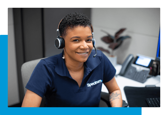 Employee smiling at their desk