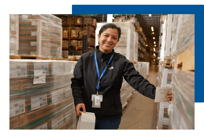 Woman smiling in warehouse