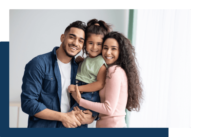 Family smiling at camera