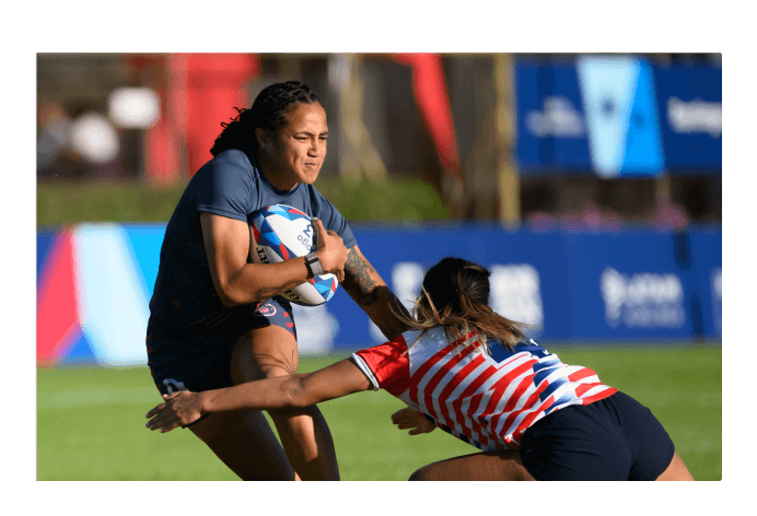 Two women playing rugby 