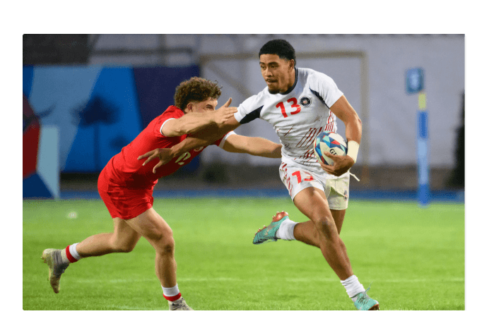 Two men playing rugby
