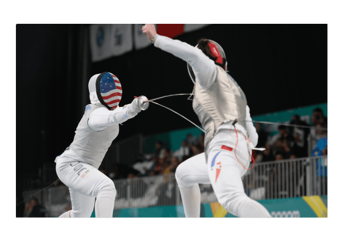 Athletes fencing 