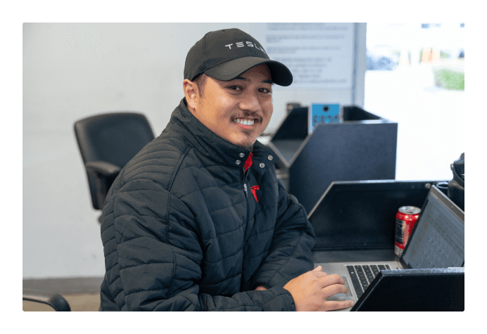 Technician working the line in a factory setting