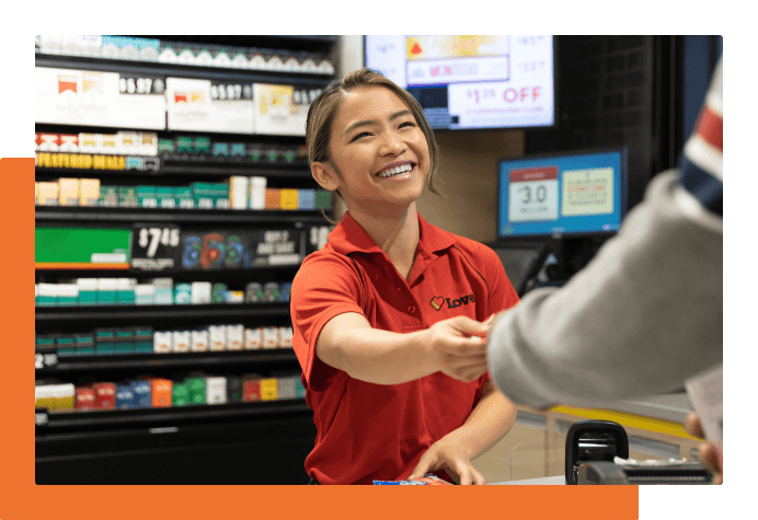 Smiling Love's employee at the register
