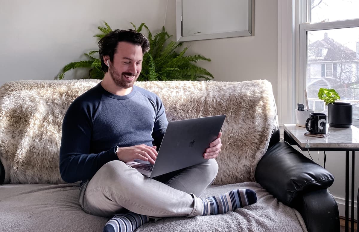 Two women looking at computer with a smile