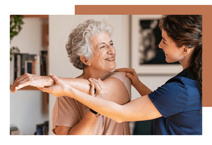 Employee helping patient stretch