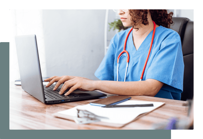 Employee typing on laptop