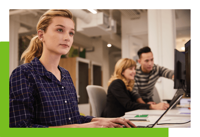 Employee typing on laptop