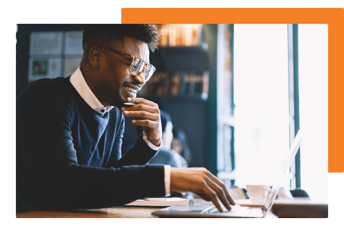 Student smiling on her laptop