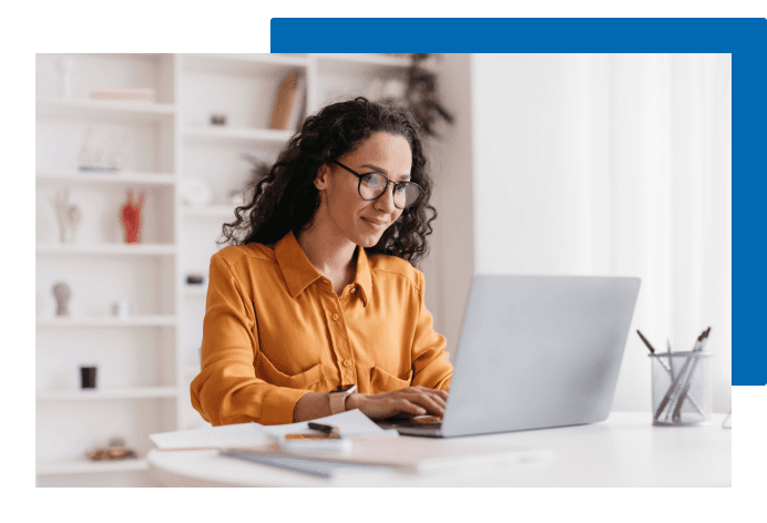 Student smiling on her laptop