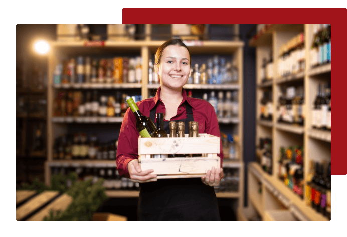 Employee carrying wine and smiling