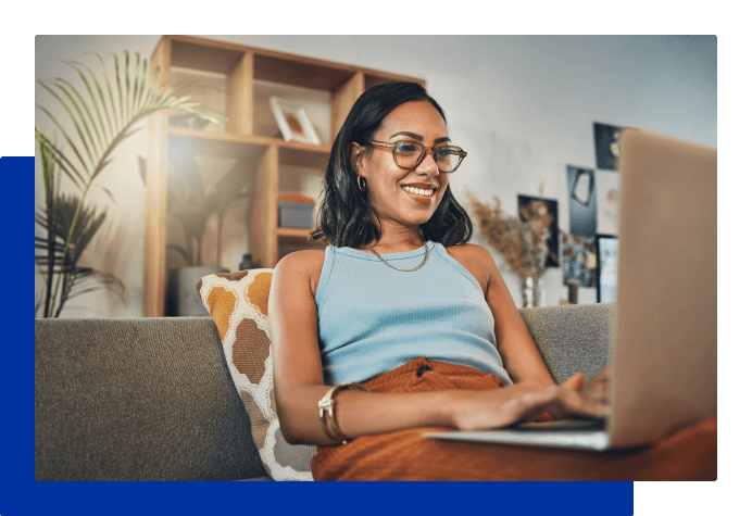 Woman smiling while on laptop