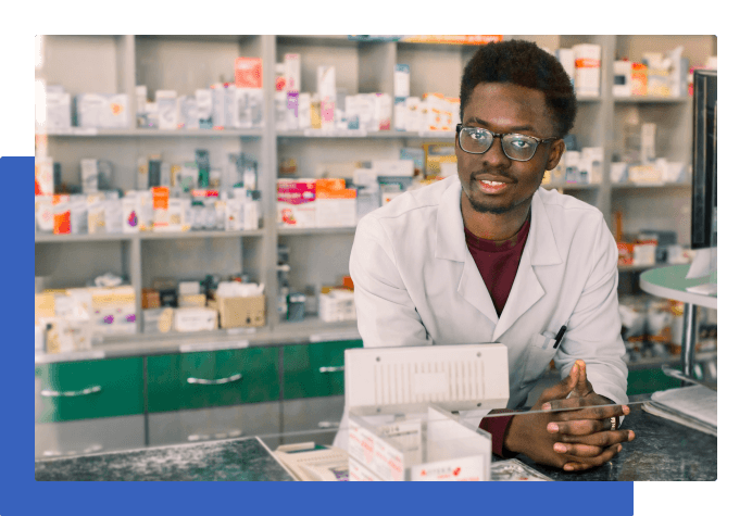Smiling person working in a pharmacy