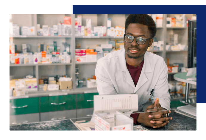 Person smiling at the register of a pharmacy