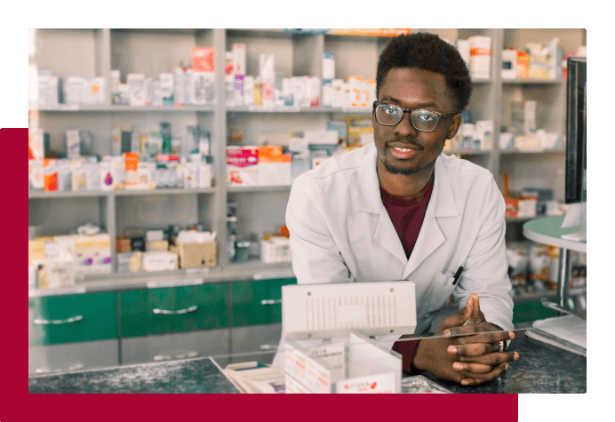 Smiling person working in a pharmacy