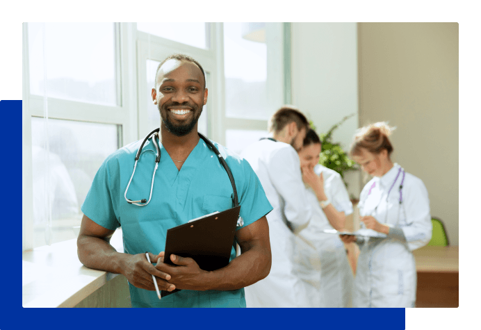 Associate in clinical setting with coworkers in the background