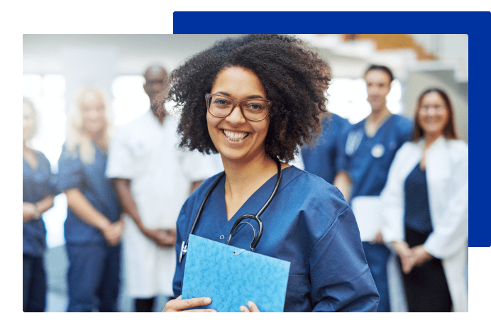 Associate in clinical setting with coworkers in the background